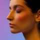 Close-up of a soft dewy cream blush flush on a woman's cheek