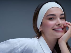 Woman with fresh, natural, glowing skin and a light tinted-moisturizer finish