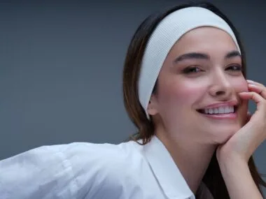 Woman with fresh, natural, glowing skin and a light tinted-moisturizer finish