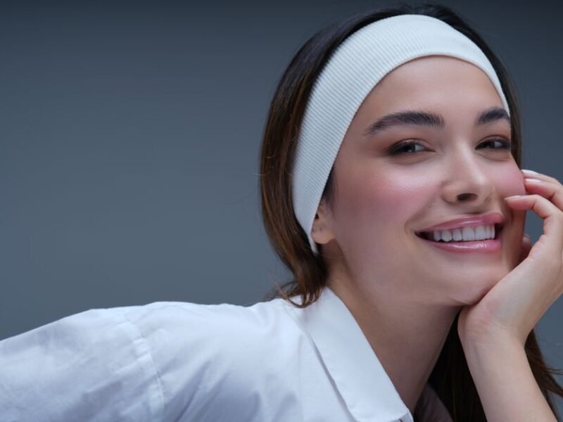 Woman with fresh, natural, glowing skin and a light tinted-moisturizer finish