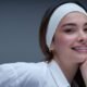 Woman with fresh, natural, glowing skin and a light tinted-moisturizer finish