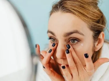 Woman applying BB cream for natural, even, glowing skin