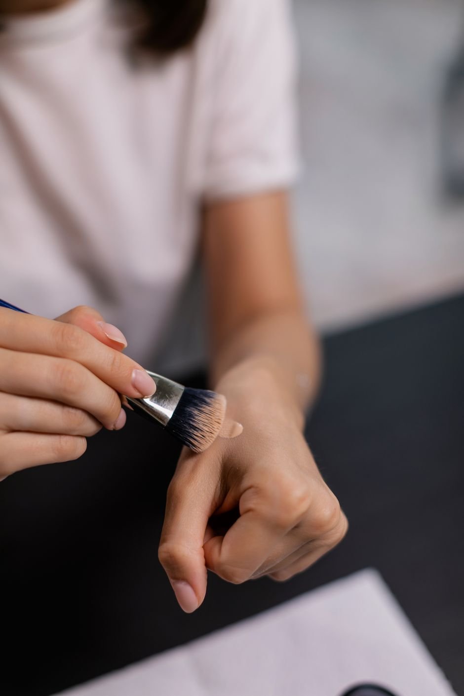 A foundation swatch blended out with a makeup brush