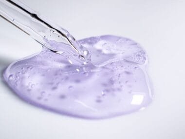 A dropper resting beside a blob of clear gel essence