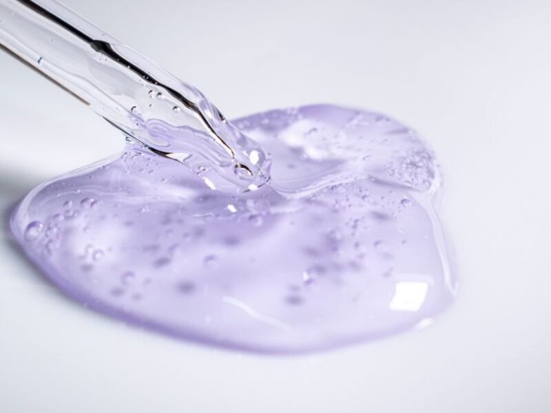 A dropper resting beside a blob of clear gel essence