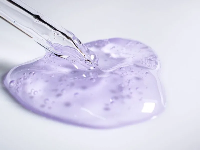 A dropper resting beside a blob of clear gel essence