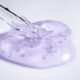 A dropper resting beside a blob of clear gel essence