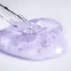 A dropper resting beside a blob of clear gel essence