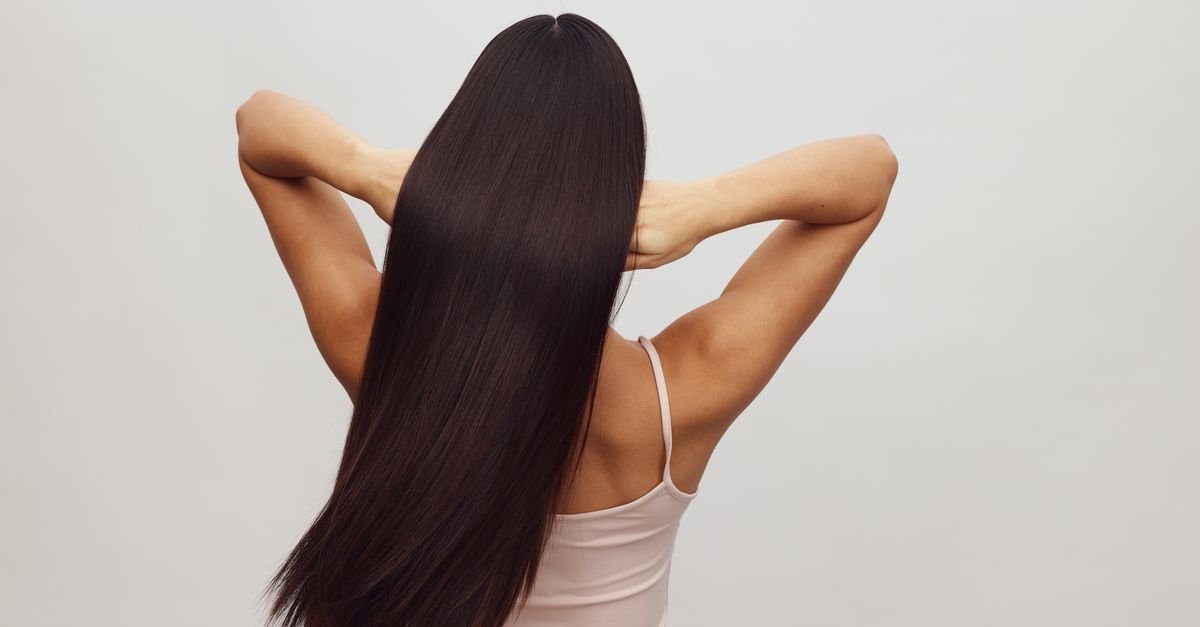 Long sleek healthy dark hair from behind
