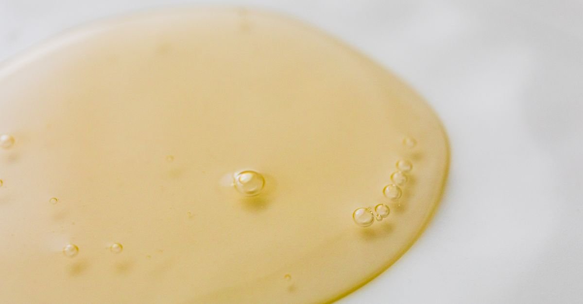 A golden gel texture swatch