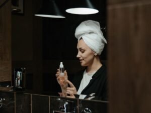 A woman doing her nighttime skincare routine