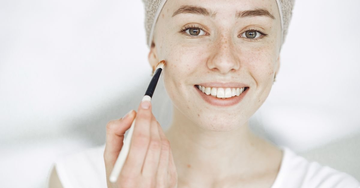 Applying niacinamide serum to freshly cleansed skin