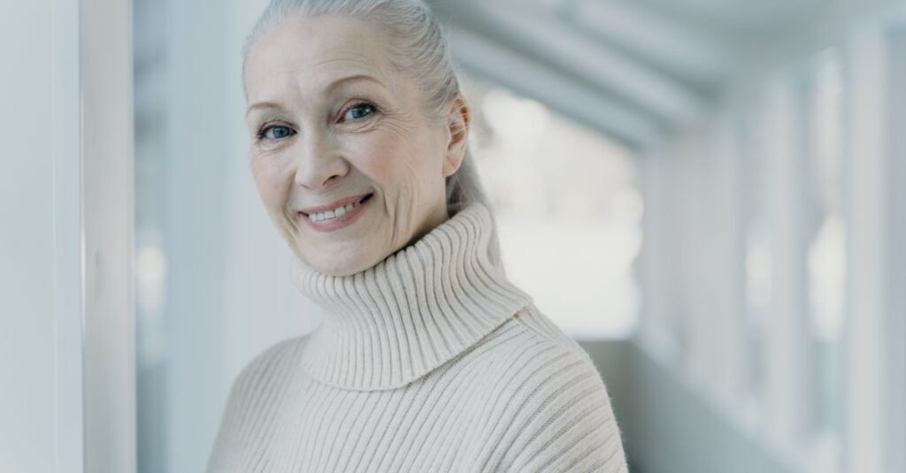 Confident silver-haired woman smiling