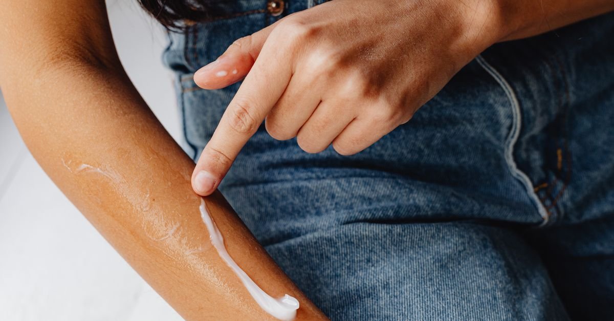 A stripe of body lotion applied along an arm