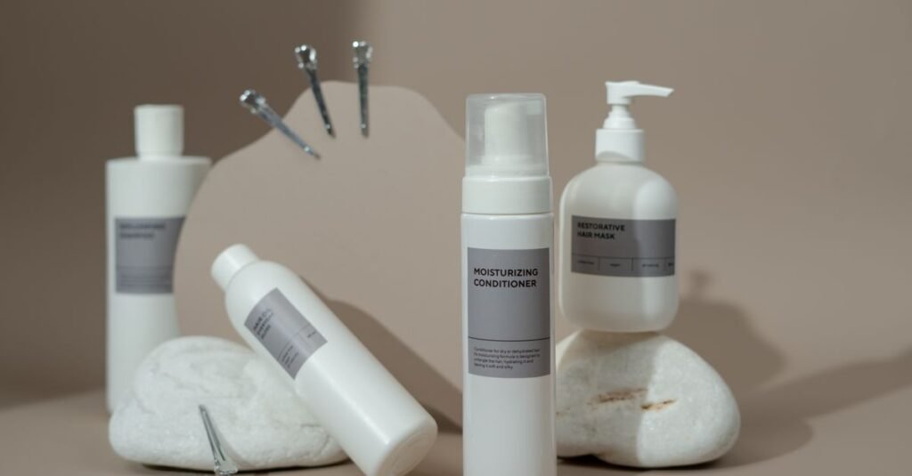 Neutral haircare bottles arranged on stone