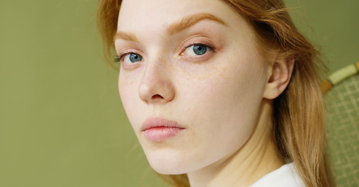 A woman with soft, dewy natural skin