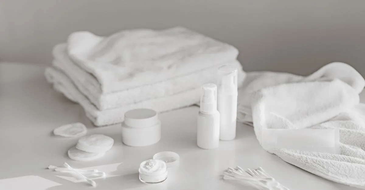 Simple white skincare products and towels