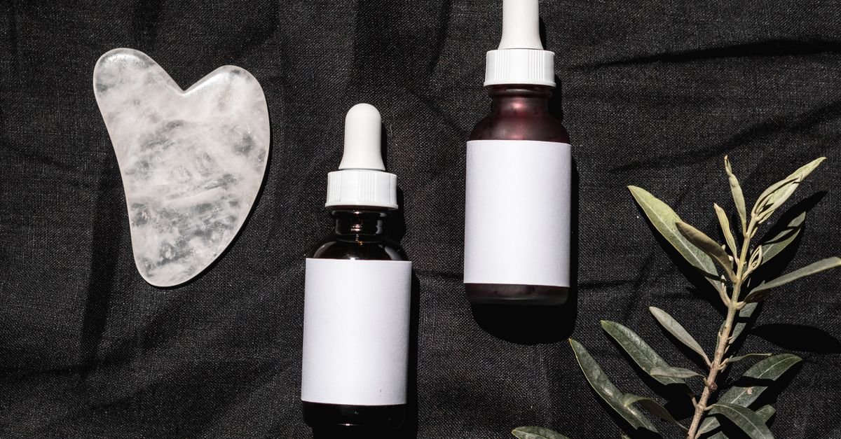Minimal flat lay of skincare dropper bottles