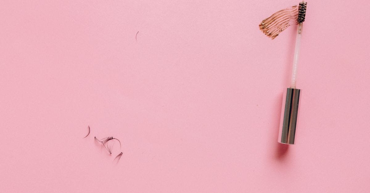 A mascara wand with a product smear