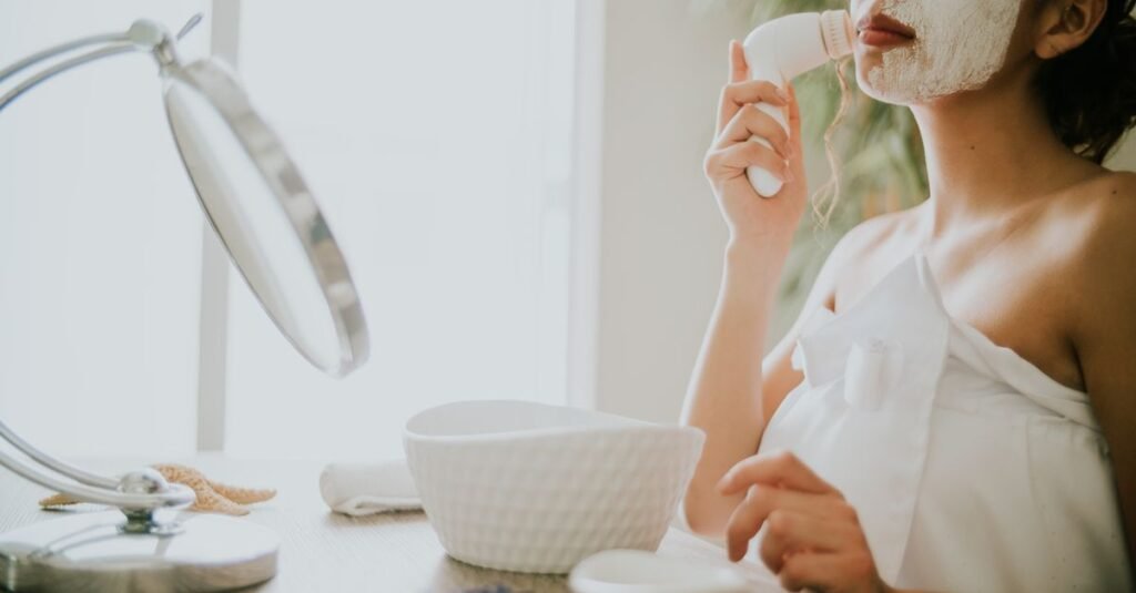 Beauty device beside a vanity mirror