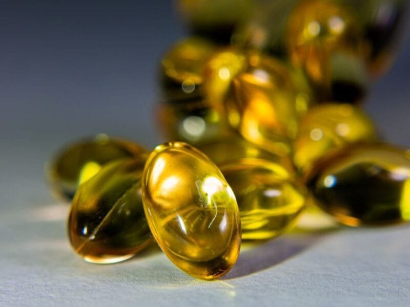 Golden vitamin E capsules in close-up