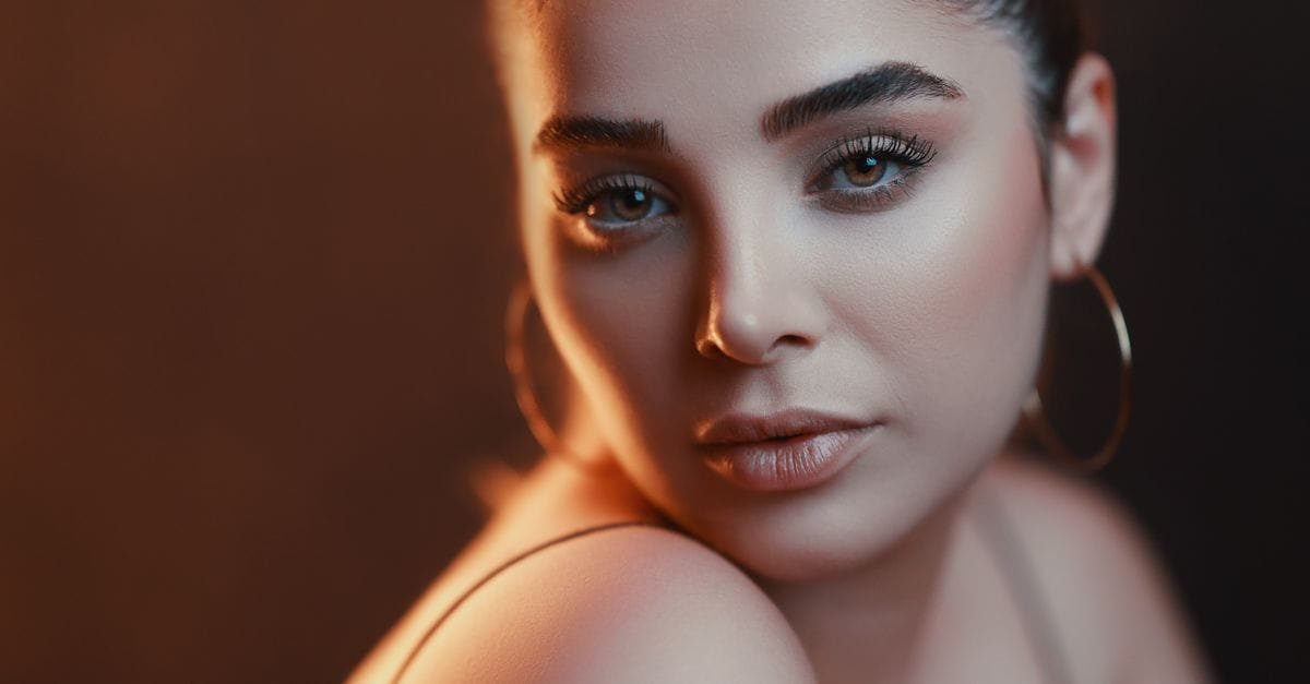 A glowing bronze-lit portrait