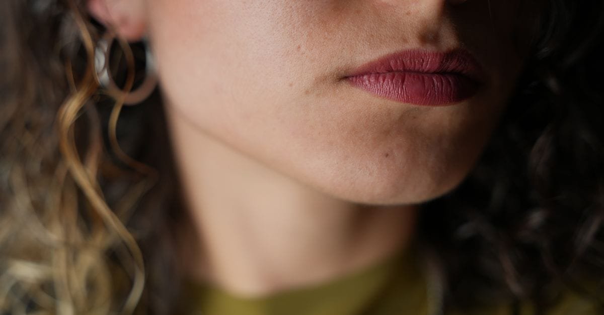 A woman&rsquo;s chin and jaw in close-up