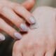 Hands with natural nails and a dab of cream