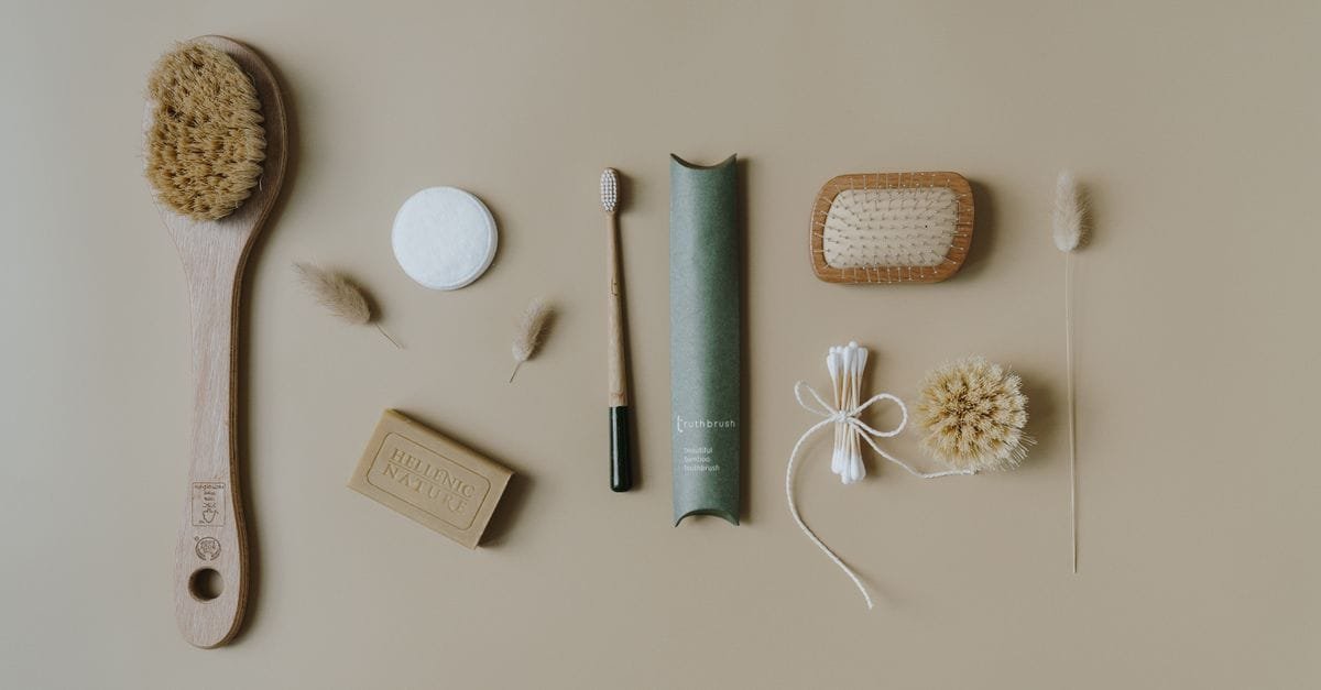 A body brush and bath tools in a flat lay