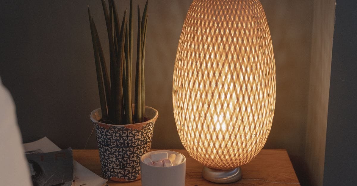 A warm bedside lamp glowing at night