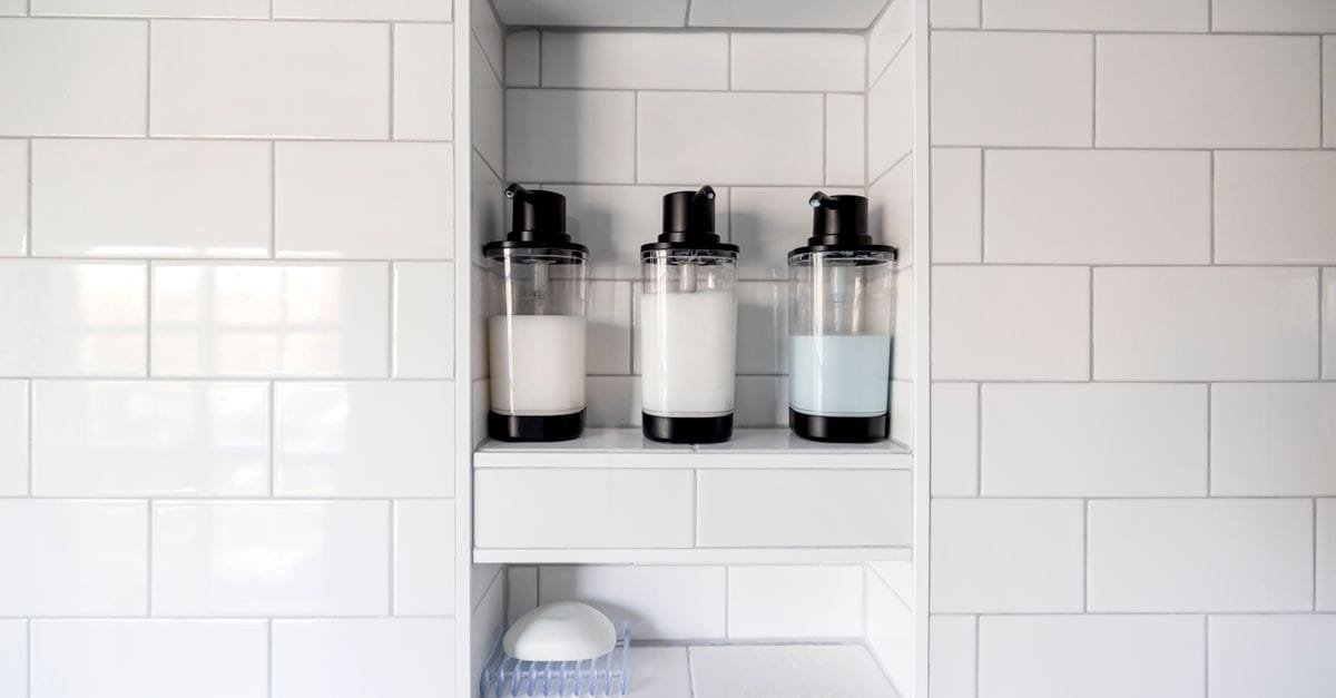 A tiled shower niche with minimal bottles