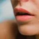 A close-up of a woman&rsquo;s chin and jawline