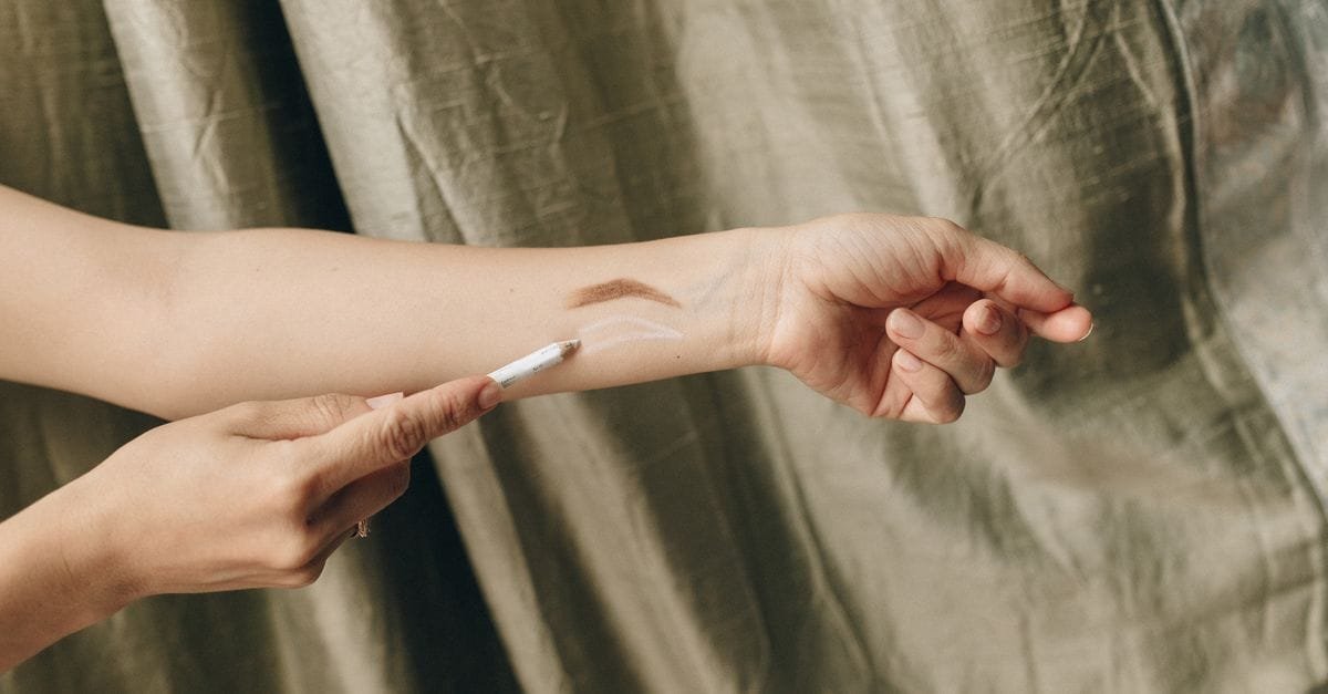 A swatch of concealer on an arm