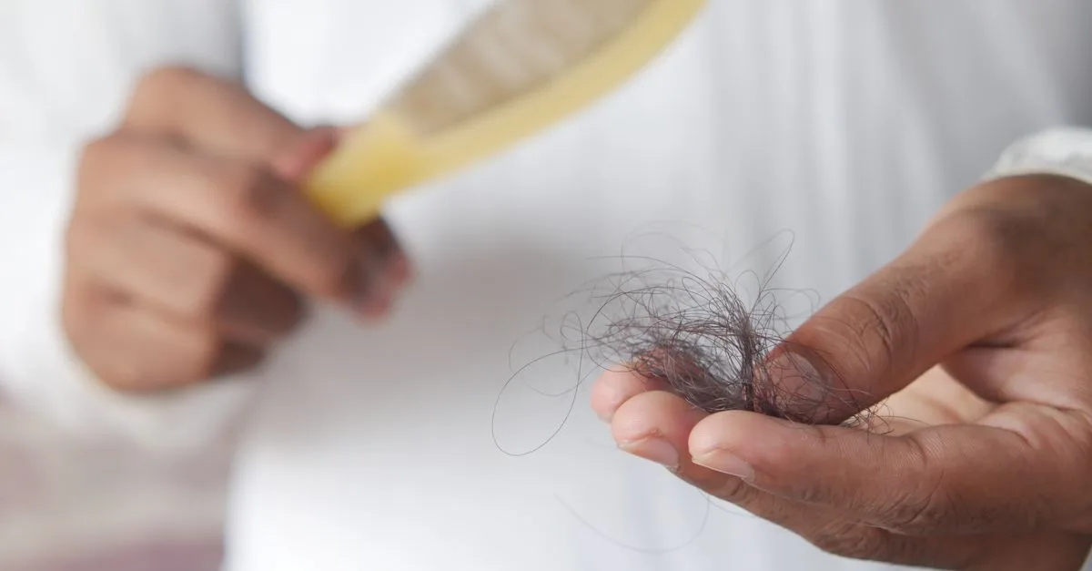 Pulling a clump of hair from a comb
